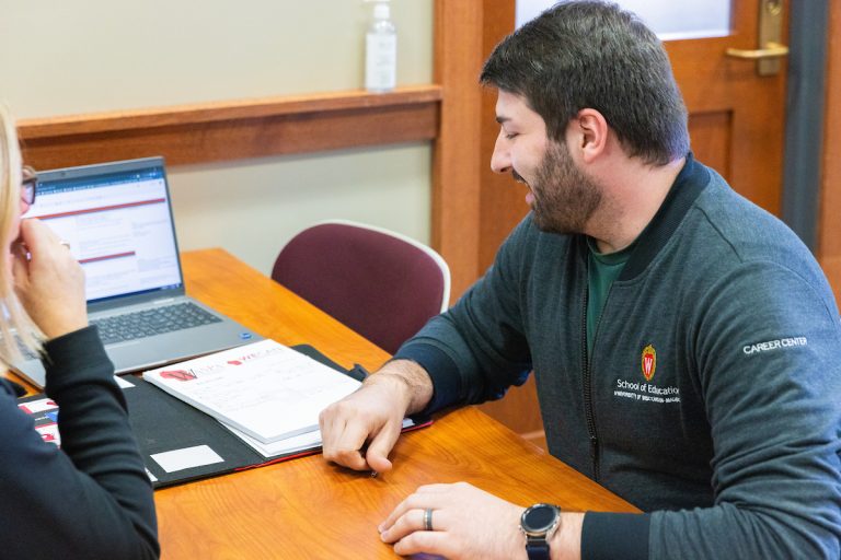 Career Center advisor working with someone