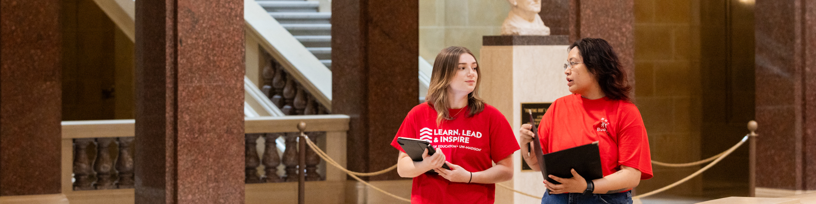 Two UW Madison students walking through the capital